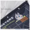 SÉRIE LES MONSTRES TOMBERENT À L&rsquo;ÉTAT SAUVAGE – Sac messager en denim