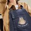 SÉRIE LES MONSTRES TOMBERENT À L&rsquo;ÉTAT SAUVAGE – Sac tablier en jean